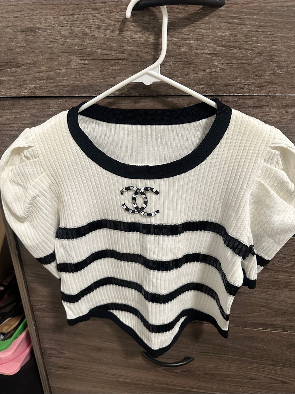 Chic Black & White Striped Knit Top with Embellished Logo size S